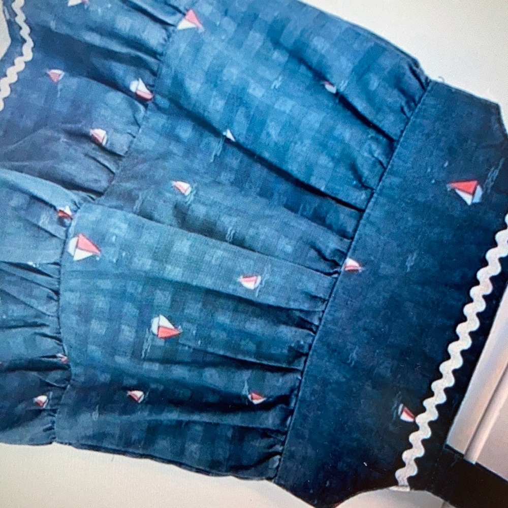 Featuring sailboat accents adorable floral dress